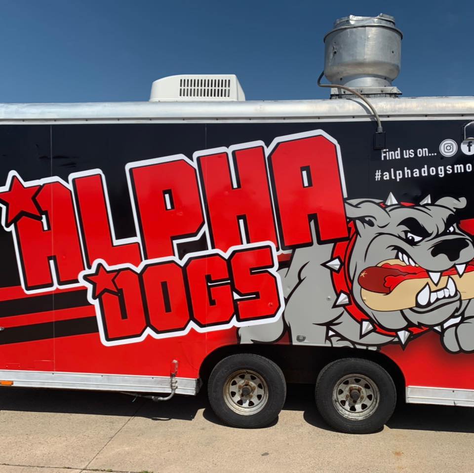 Alpha Dogs food trailer featuring a bulldog holding a hot dog