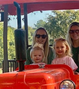 Family riding on a tractor